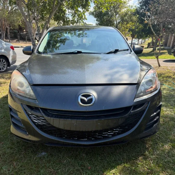 Mazda 3 on the lawn after a wash